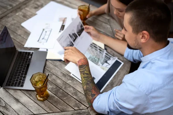 Crypto professional analyzing staking rewards and mining income data on a laptop with blockchain charts and transaction records.